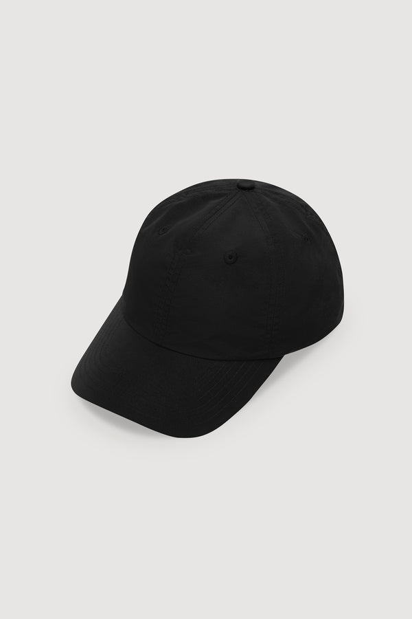 A classic nylon cap in solid black, photographed from an angle on a white background.