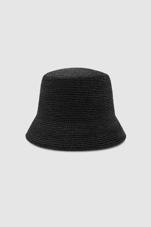 A black woven straw bucket hat, shown against a white background.