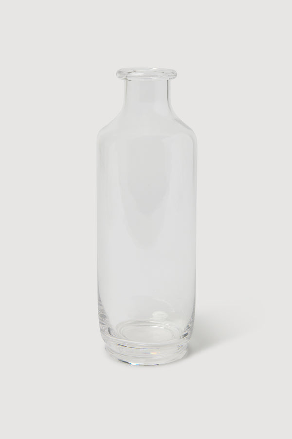 Service projects tall crystal glass clear carafe against a white background.